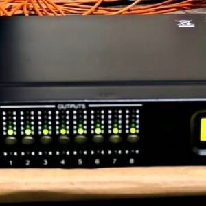 Xilica XP-8080 rackmount DSP processor showing its front-panel input and output meters and illuminated display