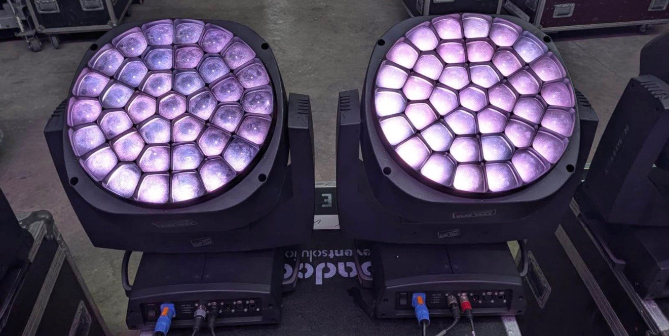 Two Claypaky A.leda B-Eye K20 LED moving head fixtures illuminated purple